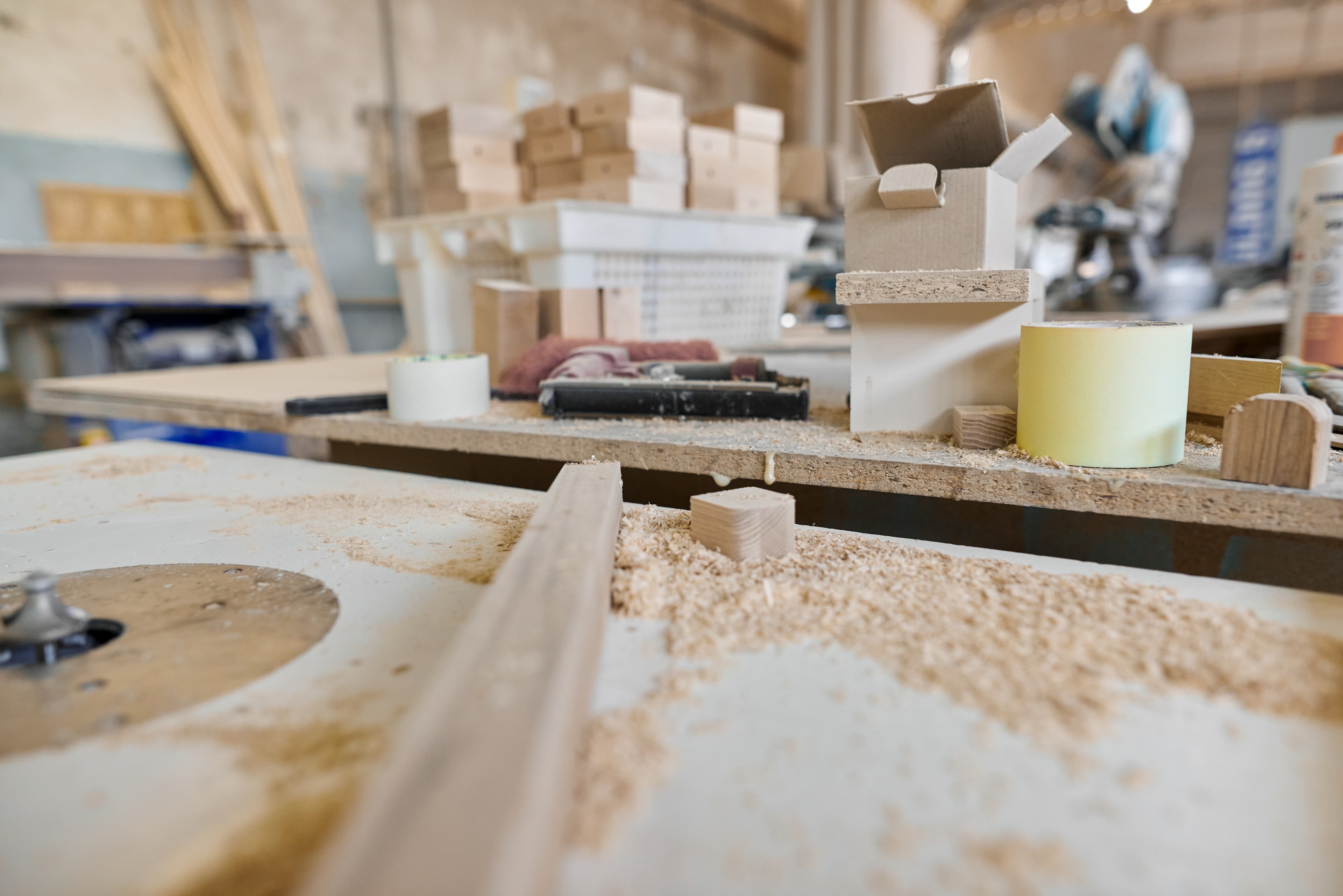 Worktable with wood and woodworking tools.